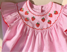 Pink and white striped dress with strawberry embroidery
