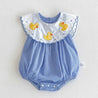 Blue checkered baby romper with white collar featuring yellow duck appliqués